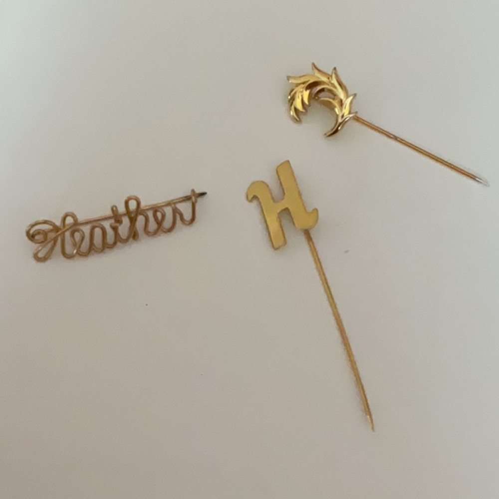 Gold Brooch Set. You get all 3. The script pin may be gold filled.